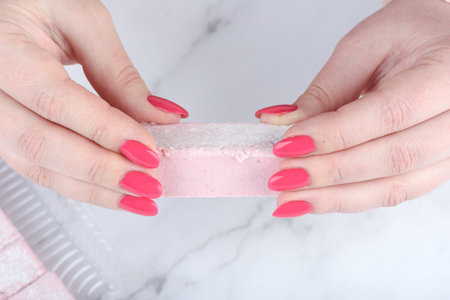 Close-up of fruit marshmallow in female hands. Copy space.の写真素材