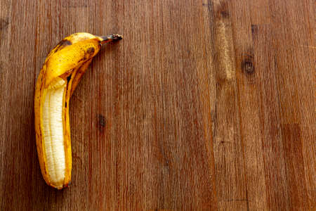 funny banana on brown tableの写真素材