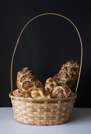 Composition with variety of challah bread in a basketの写真素材