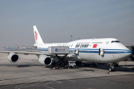 BEIJING, CHINA - FEBRUARY 22, 2016: Loading Air China plane. Air China Limited is the flag carrier and one of the major airlines of the Peoples Republic of China.のeditorial素材