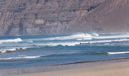 Surfers waiting for the right wave の写真素材