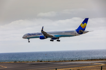 ARECIFE, SPAIN - APRIL, 15 2017: Boeing 757-300 of ThomasCook.com with the registration G-JMAA landing at Lanzarote Airportのeditorial素材