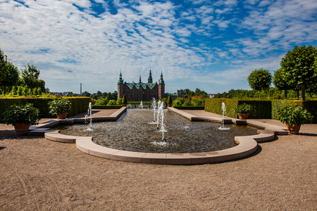 A fountain in the beautiful parkland around the great castle Frederiksborg Castle in Denmarkのeditorial素材