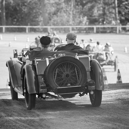 Oldtimer car race in early summer on a grass trackの写真素材