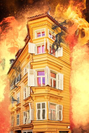 Old building in the middle of a flaming inferno with explosions in the backgroundの写真素材