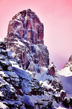 A rock of the Dolomites in soft pink sunlightの写真素材