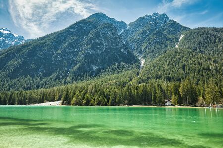 Dobbiaco Lake in front of the mountain ponarma of the Dolomites in South Tyrol