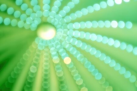 Bright aperture circles against a green backgroundの写真素材