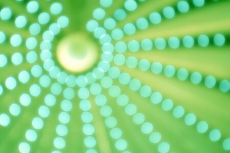 Bright aperture circles against a green backgroundの写真素材