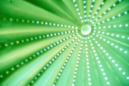 Bright aperture circles against a green backgroundの写真素材