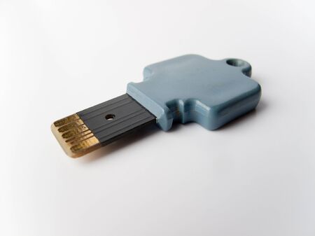 Digital Key with Microship on white backgroundの写真素材