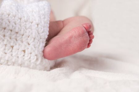 Foot of a newborn Baby in Crochet Blanketの写真素材