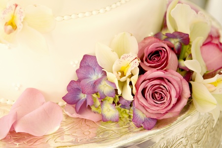 Wedding Cake lined with Tropical Flowers and Rosesの写真素材