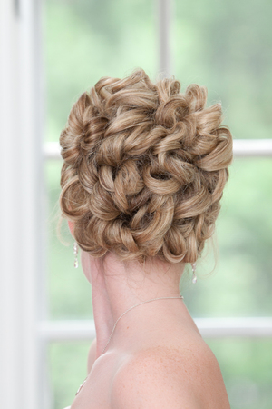 Back View of a Blonde Woman's Knotted Hair Bunの写真素材