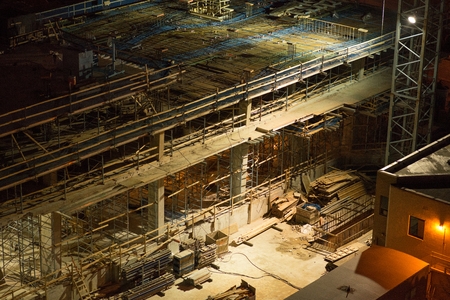 Close-Up Aerial View of a Building Site in the Dark