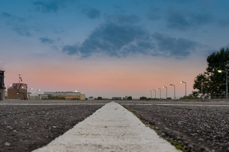 Empty parking site during sunsetの写真素材
