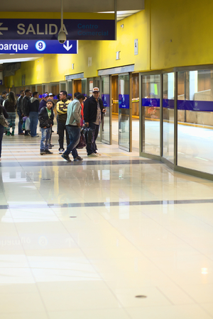 LIMA, PERU - JULY 21, 2013  Unidentified people waiting for the Metropolitano bus at the central bus station on July 21, 2013 in Lima, Peru   The Metropolitano is a Bus rapid transit sytem operating since 2010 in Lima running from North to South のeditorial素材