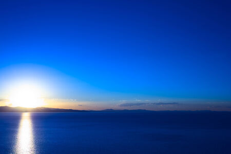 Sunset over Lake Titicaca as seen from the small town of Copacabana in Boliviaの写真素材
