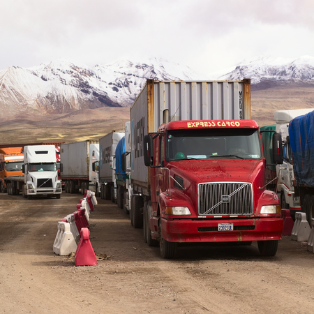 PASO CHUNGARA-TAMBO QUEMADO, CHILE-BOLIVIA - JANUARY 21, 2015: Trucks standing in line at the border...