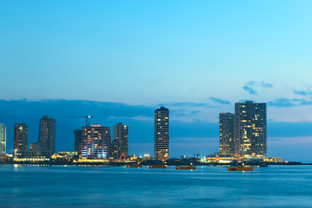 IQUIQUE, CHILE - JANUARY 22, 2015: The peninsula at the end of Cavancha beach with hotels  and modern apartment buildings photographed in the evening on January 22, 2015 in Iquique, Chileのeditorial素材
