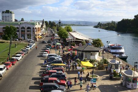 VALDIVIA, CHILE - FEBRUARY 3, 2016: View from Pedro de Valdivia bridge onto the riverside with the...