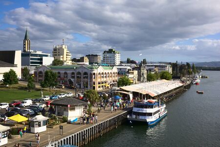 VALDIVIA, CHILE - FEBRUARY 3, 2016: View from Pedro de Valdivia bridge onto the riverside with the...