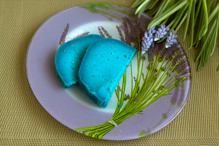 Italian blue cheese with lavender and thyme on a plate with the image of lavender and spring flower in the same range.の写真素材