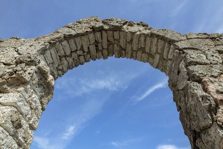 Part of the Arch of the ancient fortress of Cape Kaliakra above the sea against of the azure sky.の写真素材