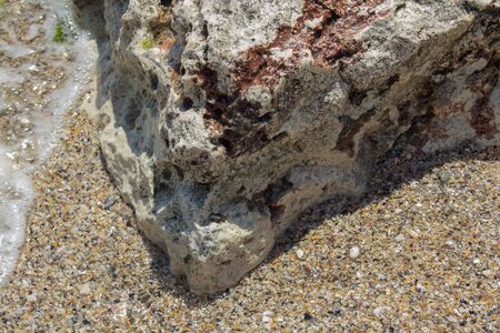 An interesting colored stone cliff on the seashore. Rusalka (Mermaid) Resort, Black Sea.