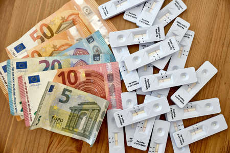 health insurance covering costs of rapid antigen self test kits home bank notes euro wood, moodyの写真素材