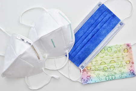 a selection of different protective face masks - ffp2 kn95 surgical and colorful children face mask...