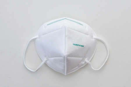 virus disease protective face mask white laboratory surface isolated objectの写真素材
