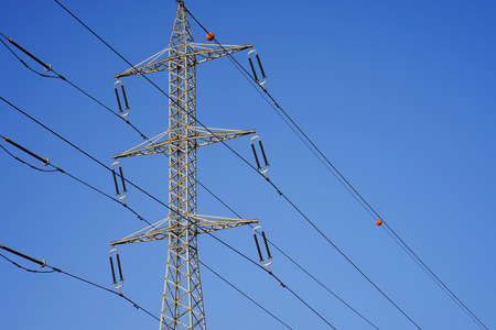 High voltage electric poles on blue sky backgroundの写真素材