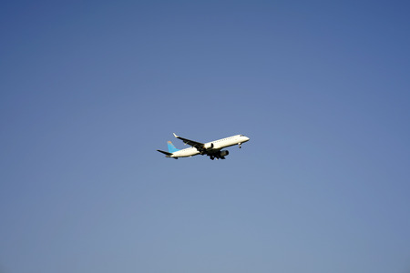 White passenger planeng  is in the blue sky. The Boeianding on the 17th of October 2017. Tel-Aviv Airportの写真素材