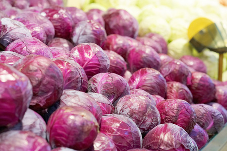 Fresh grown vegetables in market stall ready for sale at farmers marketの写真素材