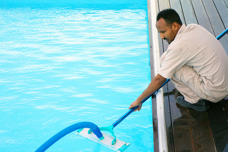 Pool cleaner during his workの写真素材