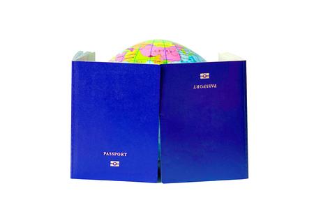 Two blue passport isolated on white background. A map or globe of planet earth. International travel identification document. The concept of travel.の写真素材