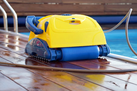 Pool cleaner during his work. Cleaning robot for cleaning the botton of swimming pools.の写真素材