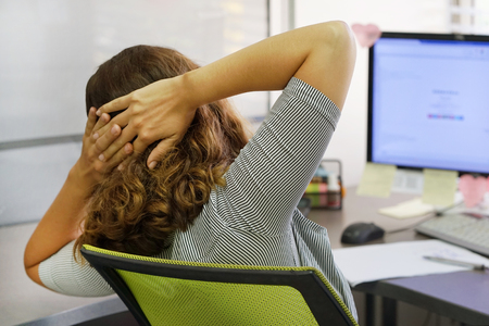 Close-up office worker Woman suffering from headache migraine pain. Health problem, stress and depression.の写真素材