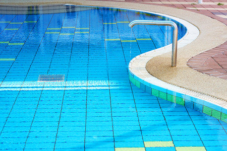 Empty indoors Children's swimming pool, public swimming pool in fitess club. Children's swimming pool with sunny reflections.の写真素材