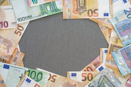 Euro banknotes laid out evenly. Financial background. Different Euro banknotes frame. business, finance, investment, saving and corruption concept - close up of Euro money over concrete background.の写真素材