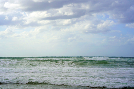 Beautiful wave on the beach. Early morning and strong wind. Cloudy morning.の写真素材