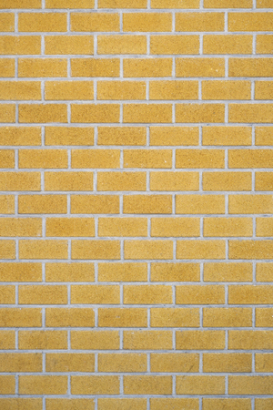 Yellow Brick wall for background or texture. Old red brick wall texture backgroundの写真素材