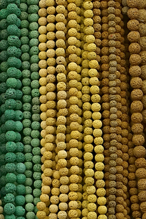 Colorful Beads Background. Background pattern of multicolored natural stone beads. String of beads in various colors. Colorful beads necklaces. Handicraft fashionable for womenの写真素材