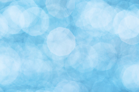 Abstract blue bokeh background. Blue christmas lights background.の写真素材