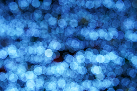 Abstract blue bokeh background. Blue christmas lights background.の写真素材