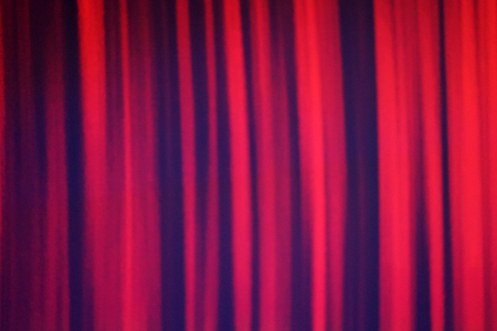 Beautiful red Abstract blurred Background with copy space. Red curtain background. Holiday texture.の写真素材