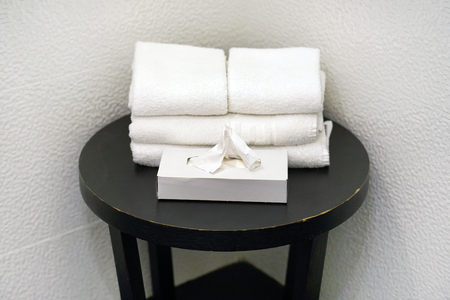 Small black table with white towels in the bathroom. Bathroom interior sink with modern design. Interior of bathroom.の写真素材