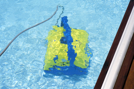Pool cleaner during his work. Cleaning robot for cleaning the botton of swimming pools.の写真素材
