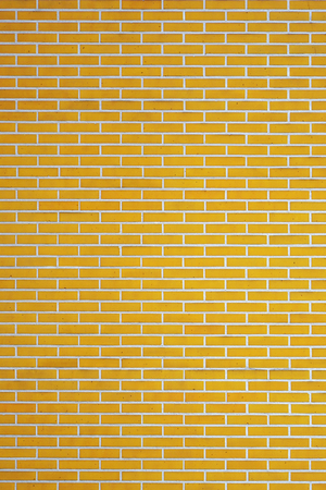 Yellow Brick wall for background or texture. Old red brick wall texture backgroundの写真素材